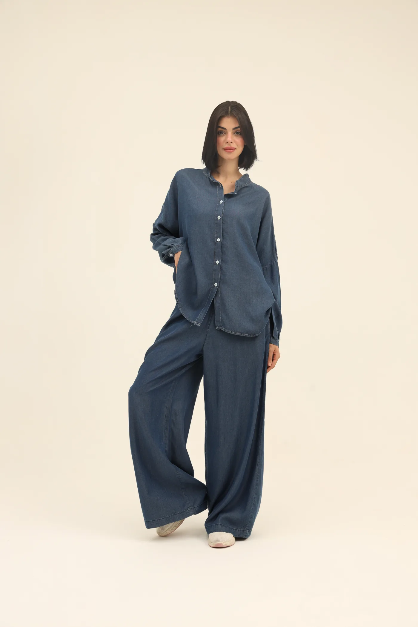 set denim shirt and trousers .